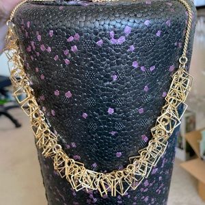 Gold necklace with geometric square shapes